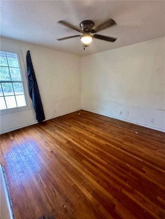 unfurnished room featuring hardwood / wood-style floors and ceiling fan