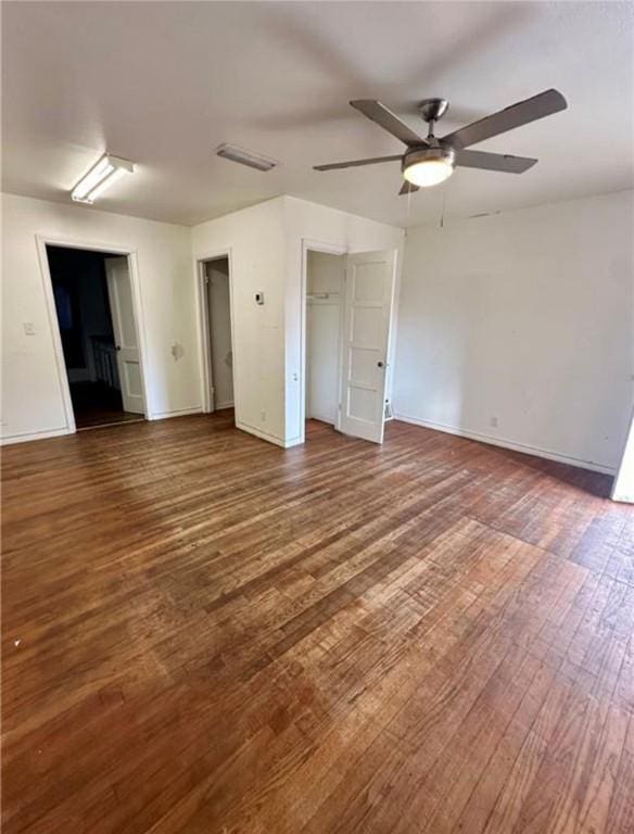 interior space featuring ceiling fan and dark wood-type flooring