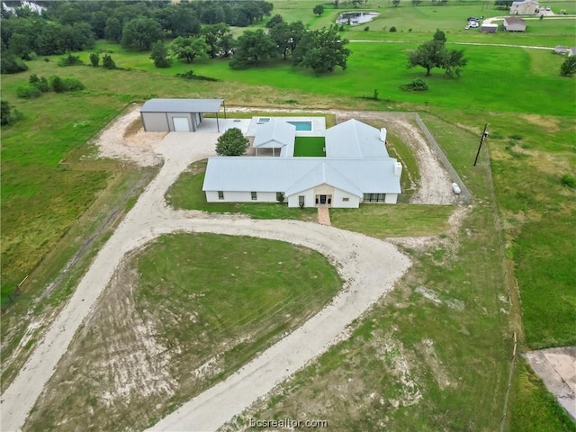 birds eye view of property with a rural view