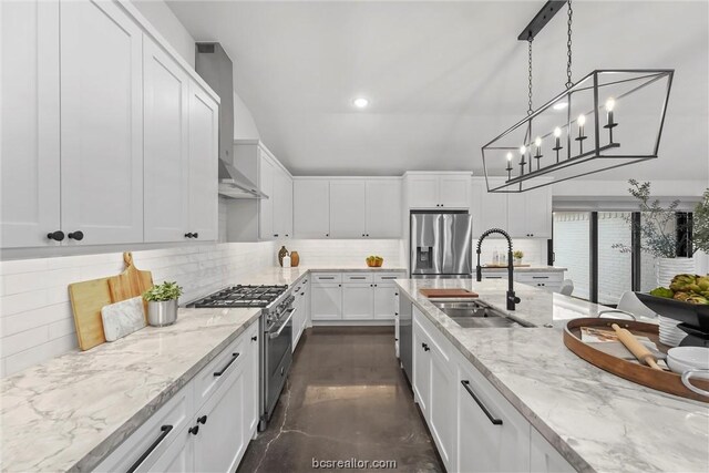 kitchen featuring white cabinetry, sink, stainless steel appliances, backsplash, and pendant lighting