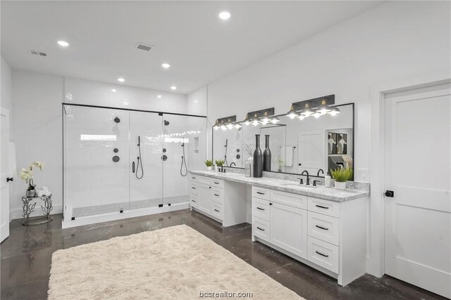 bathroom featuring vanity, concrete floors, and a shower with shower door