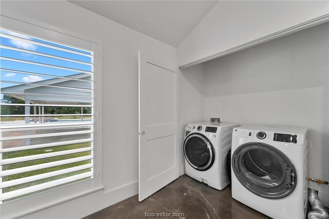 clothes washing area featuring washing machine and dryer