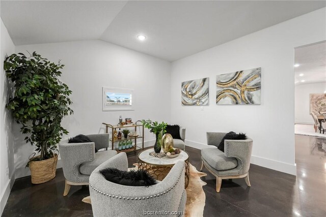 sitting room featuring lofted ceiling