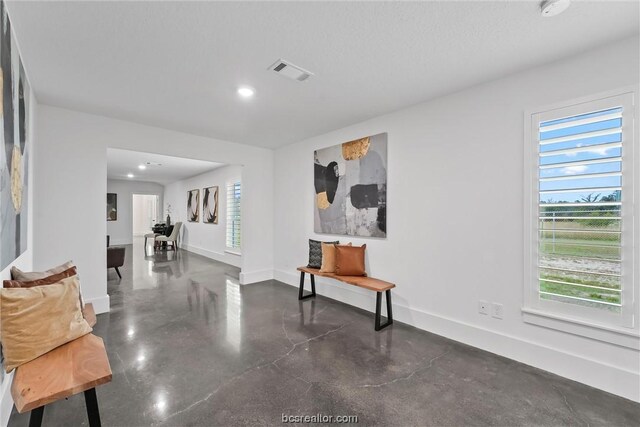 interior space with a textured ceiling