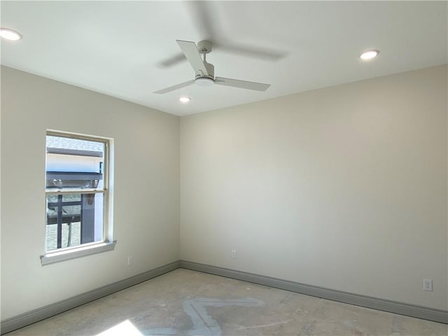 spare room with recessed lighting, ceiling fan, baseboards, and unfinished concrete floors