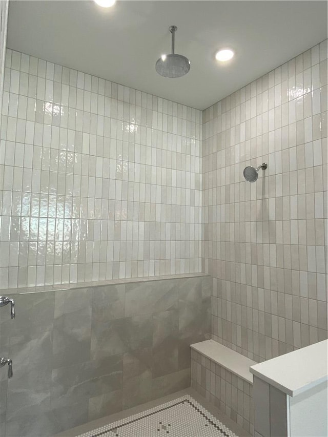 bathroom with a tile shower