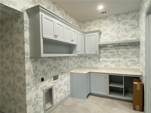 laundry room featuring washer hookup, cabinet space, hookup for an electric dryer, and wallpapered walls