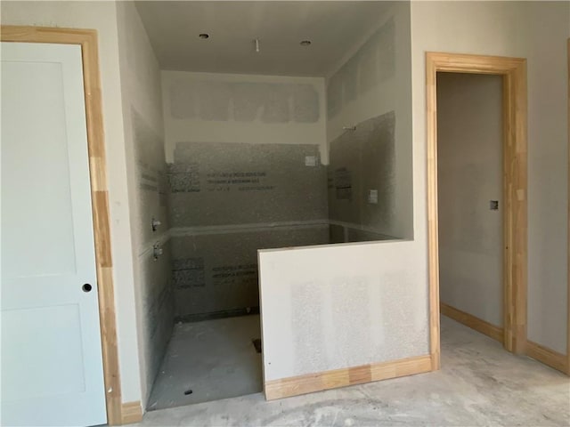 bathroom featuring concrete flooring