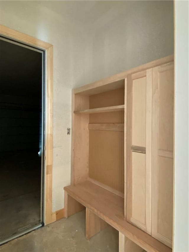 mudroom with concrete floors