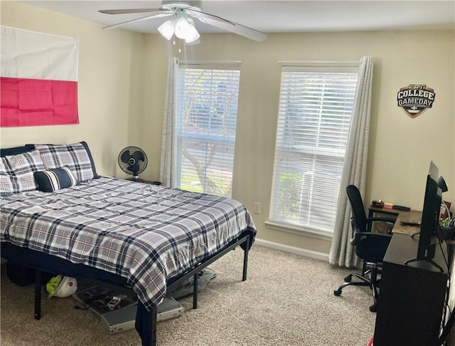 bedroom with ceiling fan and carpet