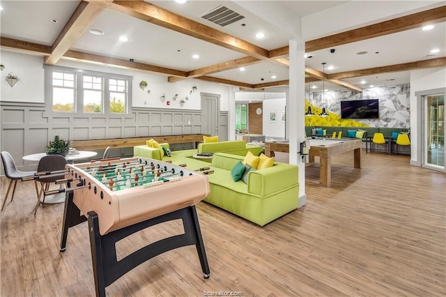 rec room featuring billiards, beam ceiling, and light hardwood / wood-style floors