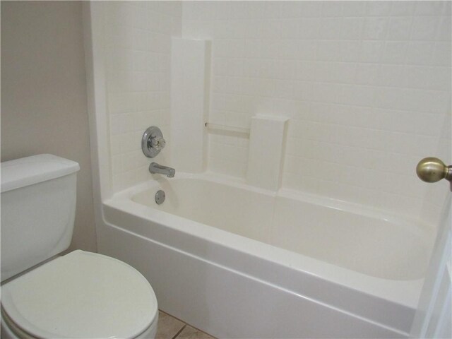 2400 Brookbend Dr, Brenham, TX 77833 - bathroom featuring washtub / shower combination and tile patterned floors