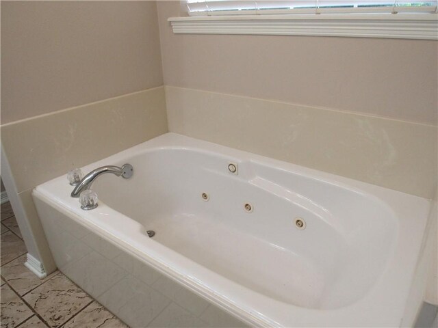 2400 Brookbend Dr, Brenham, TX 77833 - full bath with a whirlpool tub and tile patterned flooring
