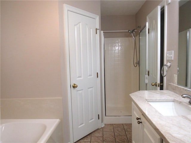 2400 Brookbend Dr, Brenham, TX 77833 - full bathroom with vanity, a stall shower, and a bath