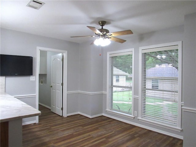2400 Brookbend Dr, Brenham, TX 77833 - unfurnished dining area featuring dark wood-type flooring, healthy amount of natural light, and ceiling fan