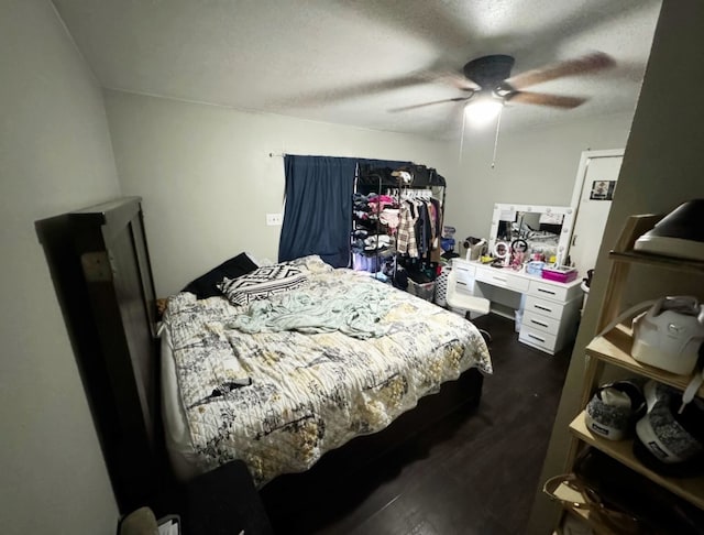 bedroom with a textured ceiling and ceiling fan