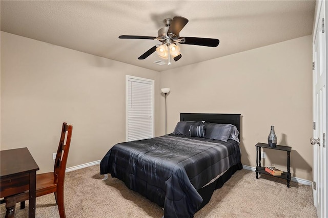 bedroom featuring light carpet and ceiling fan