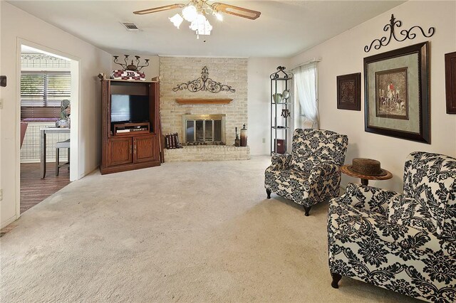 2801 Celinda Cir, College Station, TX 77845 - living room featuring carpet flooring, ceiling fan, and a fireplace