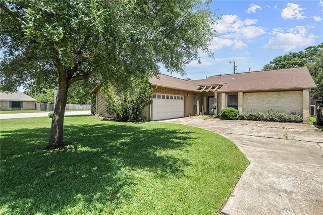2801 Celinda Cir, College Station, TX 77845 - view of front of house featuring a garage, driveway, and brick siding