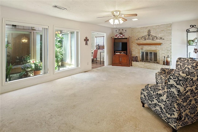 2801 Celinda Cir, College Station, TX 77845 - living area with carpet, a ceiling fan, and a brick fireplace