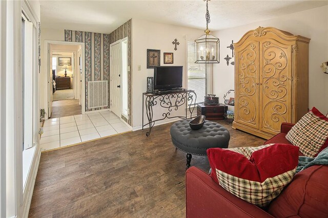 2801 Celinda Cir, College Station, TX 77845 - living area with a chandelier, wood finished floors, and baseboards
