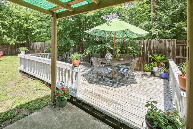 2801 Celinda Cir, College Station, TX 77845 - wooden deck with outdoor dining area and a fenced backyard