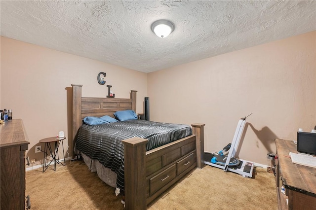 bedroom with light carpet, a textured ceiling, and baseboards