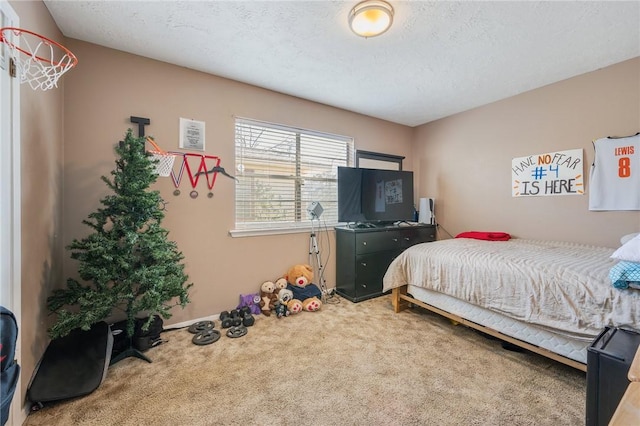 bedroom with a textured ceiling and carpet floors