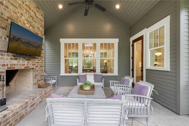 view of patio / terrace with a ceiling fan and an outdoor living space with a fireplace