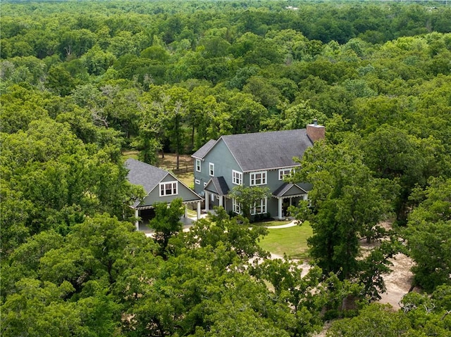 drone / aerial view featuring a view of trees