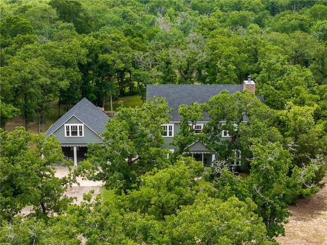 drone / aerial view featuring a view of trees