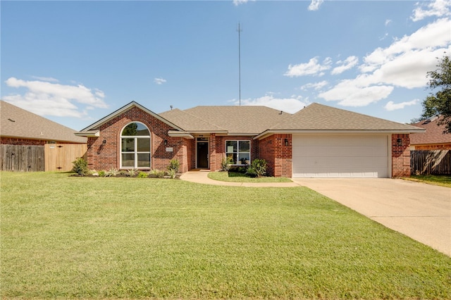 ranch-style house featuring a garage and a front yard