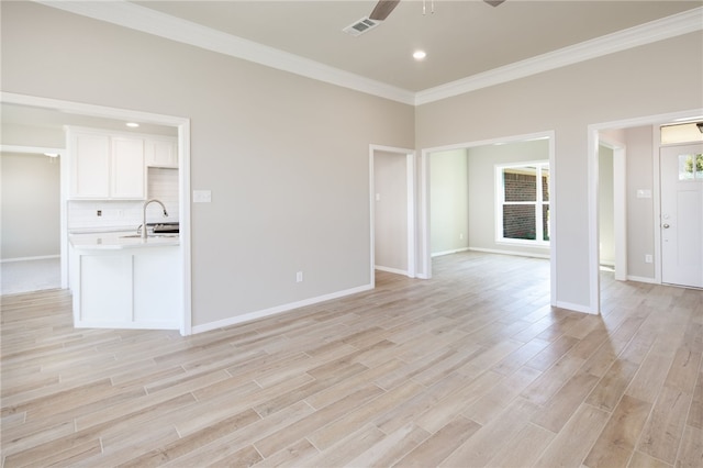 4205 Bedford Ct, Bryan, TX 77802 - unfurnished living room featuring ceiling fan, crown molding, light wood-style floors, and recessed lighting
