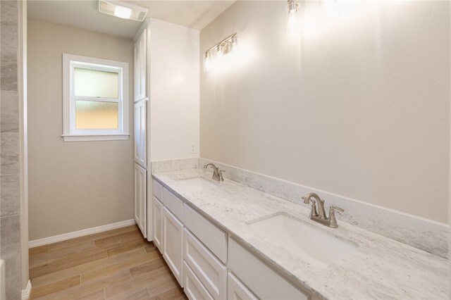 bathroom with vanity and wood-type flooring