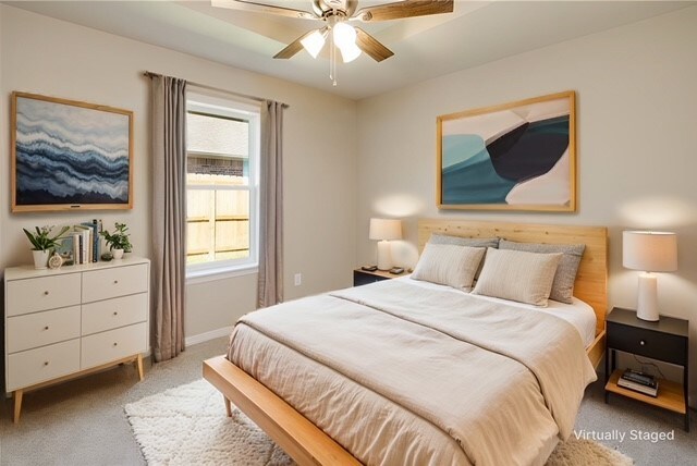 bedroom featuring ceiling fan and carpet floors