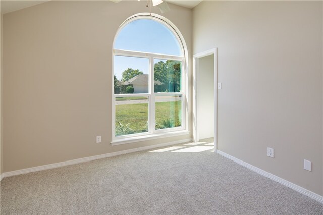 bedroom featuring baseboards, a ceiling fan, and light carpet