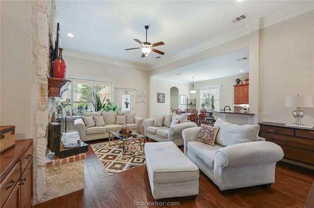 2000 Cassandra Ct, Bryan, TX 77807 - living area featuring healthy amount of natural light, dark wood-style flooring, ceiling fan, crown molding, and recessed lighting