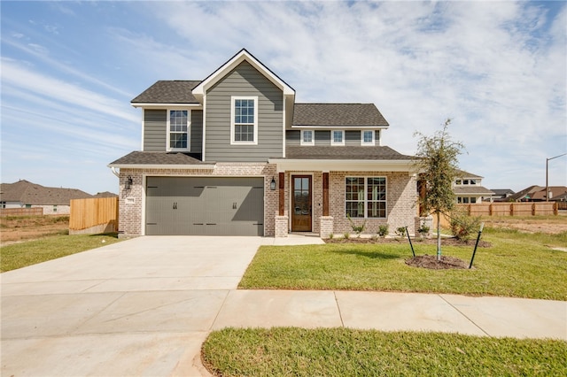 view of front of house with a garage and a front lawn