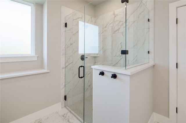 bathroom with a shower with shower door