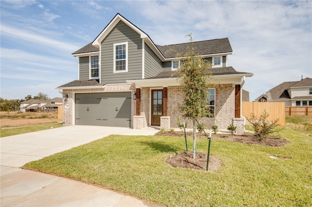 view of front facade featuring a front yard and a garage