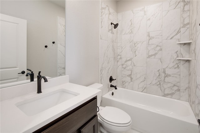 full bathroom with toilet, vanity, and tiled shower / bath