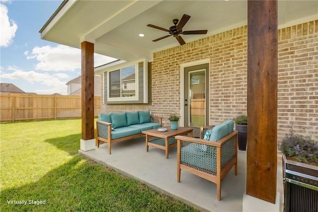 view of patio featuring an outdoor hangout area and ceiling fan