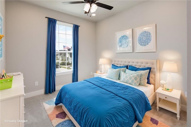 bedroom featuring ceiling fan and light colored carpet