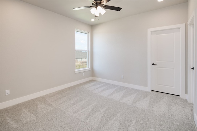 unfurnished room featuring carpet flooring and ceiling fan