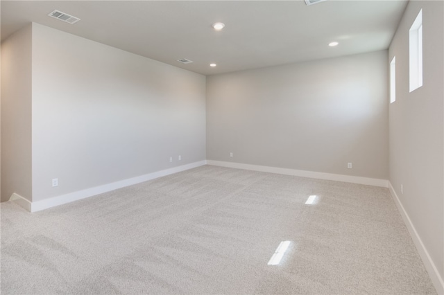 spare room with light colored carpet