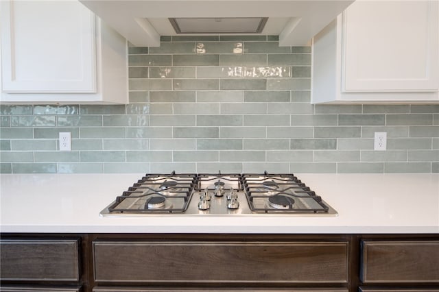 kitchen with white cabinetry, backsplash, and stainless steel gas cooktop