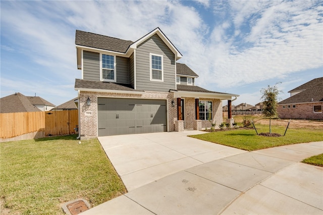 view of front of house with a garage and a front yard