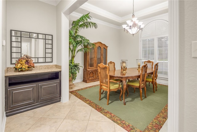 4309 Berwick Pl, College Station, TX 77845 - dining space featuring a chandelier, crown molding, a raised ceiling, and light tile patterned floors