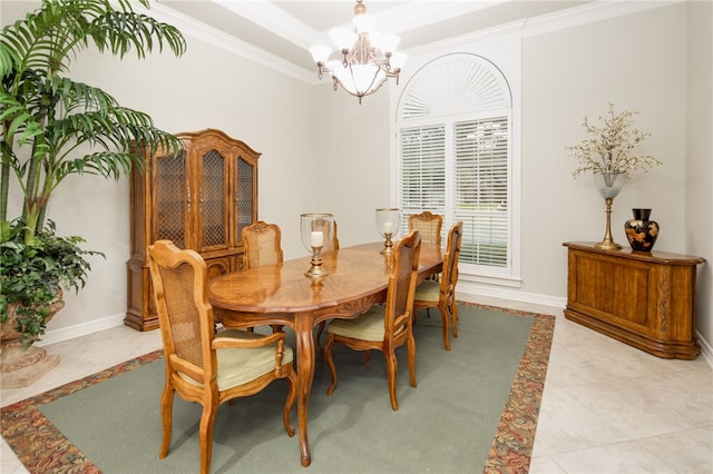 4309 Berwick Pl, College Station, TX 77845 - dining space with crown molding, a chandelier, light tile patterned floors, a tray ceiling, and baseboards