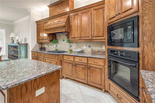 4309 Berwick Pl, College Station, TX 77845 - kitchen with black appliances, brown cabinets, backsplash, crown molding, and light stone counters